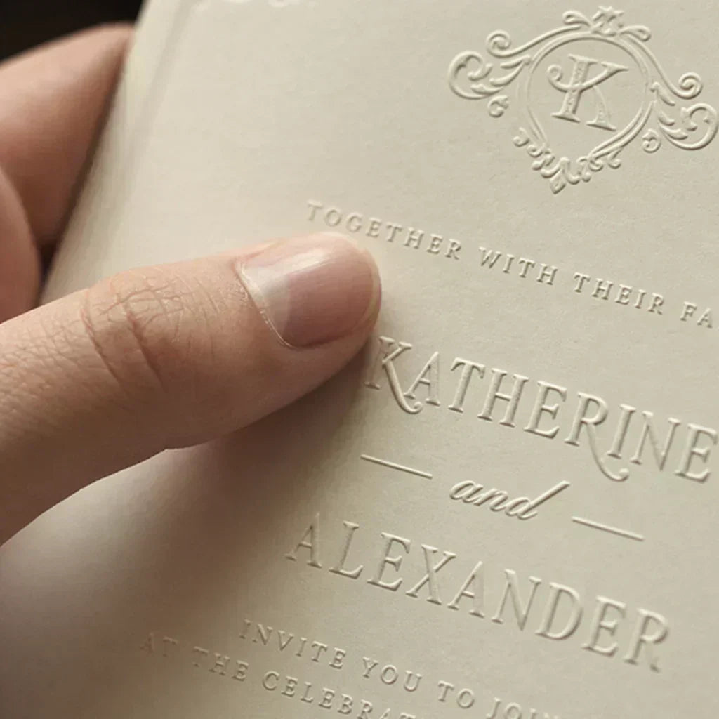 A close-up of a luxury Lemargia wedding invitation sample featuring crisp intaglio engraved lettering